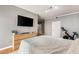 Relaxing primary bedroom with a large bed and mounted television for easy viewing at 5855 Valley Dr # 1080, North Las Vegas, NV 89031
