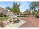 Outdoor picnic area with seating and walking paths amongst trees, and community residences at 5855 Valley Dr # 1080, North Las Vegas, NV 89031