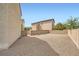 Expansive backyard area offers privacy with its sturdy block wall and gravel at 6153 Sea Cliff Cove St, North Las Vegas, NV 89031