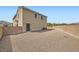 Low-maintenance backyard with gravel, offering a private outdoor space and block wall at 6153 Sea Cliff Cove St, North Las Vegas, NV 89031