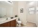 Cozy bathroom with tiled floors, a shower, and a framed art print hanging above the toilet at 6153 Sea Cliff Cove St, North Las Vegas, NV 89031