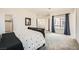 Spacious bedroom with neutral walls, plush carpet, and a window with bright natural light at 6153 Sea Cliff Cove St, North Las Vegas, NV 89031