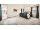 Bright bedroom with large windows, neutral carpet, and arched entry to bathroom at 6153 Sea Cliff Cove St, North Las Vegas, NV 89031