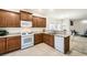 Kitchen featuring modern appliances and abundant cabinet space, flowing into a dining area with stylish decor at 6153 Sea Cliff Cove St, North Las Vegas, NV 89031