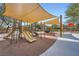 A modern playground with shade canopies and multiple play structures for  at 6153 Sea Cliff Cove St, North Las Vegas, NV 89031