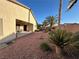 Spacious backyard features desert landscaping, patio area, and privacy fencing at 6475 Benbrook Springs Dr, Las Vegas, NV 89131