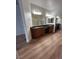 Bathroom with dual sinks and large vanity area, and mirrored closet at 6475 Benbrook Springs Dr, Las Vegas, NV 89131