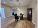 Formal dining room featuring modern lighting, vinyl flooring and classic hutch at 6475 Benbrook Springs Dr, Las Vegas, NV 89131