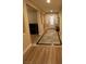 Foyer entrance featuring tile flooring with decorative trim and sidelight windows to brighten the area at 6475 Benbrook Springs Dr, Las Vegas, NV 89131