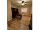 Home office featuring built-in desk, bookshelves, and wood-look floors at 6475 Benbrook Springs Dr, Las Vegas, NV 89131