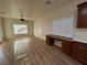 Living room featuring wood-look floors, ceiling fan, and natural light at 6475 Benbrook Springs Dr, Las Vegas, NV 89131