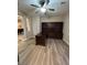 Office features a dark wood built in desk and cabinetry with hardwood floors and ceiling fan at 6475 Benbrook Springs Dr, Las Vegas, NV 89131