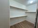 An organized walk-in closet provides ample storage with multiple shelves and hanging rods at 6475 Benbrook Springs Dr, Las Vegas, NV 89131