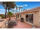 Back patio with outdoor dining and BBQ area, perfect for entertaining and relaxing at 6654 Coronado Crest Ave, Las Vegas, NV 89139