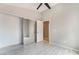 Bedroom features mirrored closet doors, neutral paint, and light wood floors at 6654 Coronado Crest Ave, Las Vegas, NV 89139