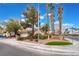 Single-story home featuring desert landscaping, tile roof, and mature trees at 6654 Coronado Crest Ave, Las Vegas, NV 89139