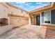 View of the front entry featuring brick walkway and outdoor fireplace at 6654 Coronado Crest Ave, Las Vegas, NV 89139