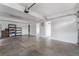 Spacious garage featuring ample storage, epoxy floors, and access to the home at 6654 Coronado Crest Ave, Las Vegas, NV 89139