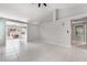Spacious living room with vaulted ceilings, tile flooring, and ample natural light at 6654 Coronado Crest Ave, Las Vegas, NV 89139