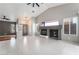 Bright living room boasts vaulted ceilings, tiled floors, and a modern fireplace feature at 6654 Coronado Crest Ave, Las Vegas, NV 89139