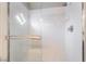 Shower with clear glass door and white tile surround at 6654 Coronado Crest Ave, Las Vegas, NV 89139