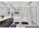 Modern bathroom with a soaking tub, glass-enclosed shower, and dark wood cabinets at 7115 Calvert Cliffs St, North Las Vegas, NV 89084