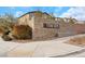 Stone Creek community entrance with attractive stone wall, landscaping, and signage, showcasing neighborhood appeal at 7115 Calvert Cliffs St, North Las Vegas, NV 89084