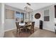 Cozy dining area featuring a round table, neutral decor, and natural light, perfect for Gathering meals and gatherings at 7115 Calvert Cliffs St, North Las Vegas, NV 89084