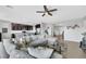 Spacious living room featuring a comfortable sectional sofa, hardwood floors, and an open layout at 7115 Calvert Cliffs St, North Las Vegas, NV 89084