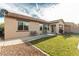 Nice backyard featuring an extended patio, lawn area, and desert landscaping at 7386 Campbell Ranch Ave, Las Vegas, NV 89179