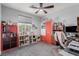 Bedroom with neutral carpet, a ceiling fan, and various storage solutions for organization at 7386 Campbell Ranch Ave, Las Vegas, NV 89179