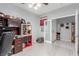 Bedroom with ceiling fan, and double doors leading to tiled hallway at 7386 Campbell Ranch Ave, Las Vegas, NV 89179