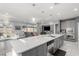 Open concept kitchen featuring a large island and a view to the living area at 7386 Campbell Ranch Ave, Las Vegas, NV 89179