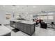 Open-concept kitchen boasts a large island, stainless appliances, and seamless flow to the living area at 7386 Campbell Ranch Ave, Las Vegas, NV 89179
