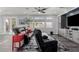 Inviting living room showcasing a large sofa, modern decor, and ample natural light at 7386 Campbell Ranch Ave, Las Vegas, NV 89179