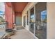 Inviting balcony with outdoor seating, offering a view of the community and blue skies at 75 E Agate Ave # 204, Las Vegas, NV 89123