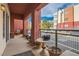 Charming balcony with potted plants and a view of the surrounding neighborhood at 75 E Agate Ave # 204, Las Vegas, NV 89123