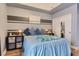 Comfortable bedroom featuring a decorative wall stripe, ample closet space, and contemporary decor at 75 E Agate Ave # 204, Las Vegas, NV 89123