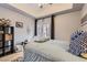 Inviting bedroom with a view of the balcony, featuring hardwood floors and stylish accents at 75 E Agate Ave # 204, Las Vegas, NV 89123