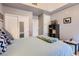Bright bedroom featuring hardwood floors, a closet, and a view of the balcony at 75 E Agate Ave # 204, Las Vegas, NV 89123