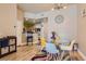 Open-concept dining area with a glass table and view into the kitchen and living space at 75 E Agate Ave # 204, Las Vegas, NV 89123