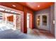 Condo entrance with red accents, gray walls, and concrete flooring at 75 E Agate Ave # 204, Las Vegas, NV 89123