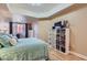 Inviting bedroom with ample natural light, a large bed, and functional storage solutions with a calming ambiance at 75 E Agate Ave # 204, Las Vegas, NV 89123