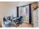 Bright office featuring a modern glass desk, comfortable chair, and ample natural light for a productive work space at 75 E Agate Ave # 204, Las Vegas, NV 89123