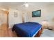 Bedroom featuring an ensuite bathroom and wood laminate flooring at 7945 Delbonita Ave, Las Vegas, NV 89147