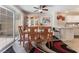Charming dining area with glass sliding doors and modern ceiling fan at 7945 Delbonita Ave, Las Vegas, NV 89147