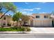 Charming home features a landscaped yard and a two-car garage for added convenience at 7945 Delbonita Ave, Las Vegas, NV 89147