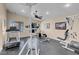 Community gym featuring modern exercise equipment, including a treadmill and weight machine at 7945 Delbonita Ave, Las Vegas, NV 89147