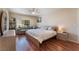 Bright main bedroom with hardwood floors, seating area, and a large window at 7945 Delbonita Ave, Las Vegas, NV 89147