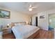 Comfortable main bedroom with hardwood floors, en suite bath, and neutral walls at 7945 Delbonita Ave, Las Vegas, NV 89147